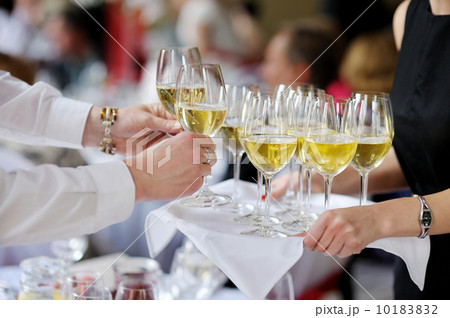 Waitress with dish of champagne glasses Waitress with dish of champagne glasses 10183832