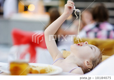 Cute little girl eating spaghetti Cute little girl eating spaghetti 10184075