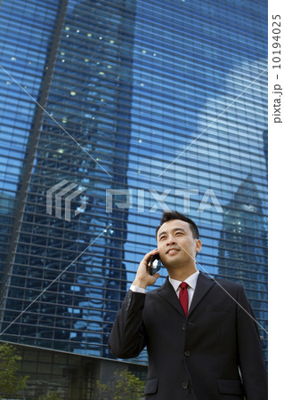 Asian businessman with mobile phone 10194025