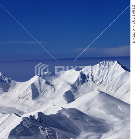 View on off-piste snowy slope at nice sunny day View on off-piste snowy slope at nice sunny day 10219912
