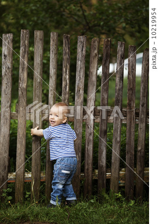 little boy with fence outdoors 10219954