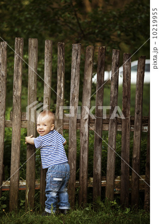 little boy with fence outdoors little boy with fence outdoors 10219955