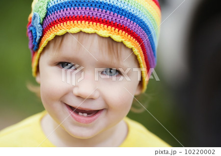 cute little girl portrait with rainbow hat cute little girl portrait with rainbow hat 10220002