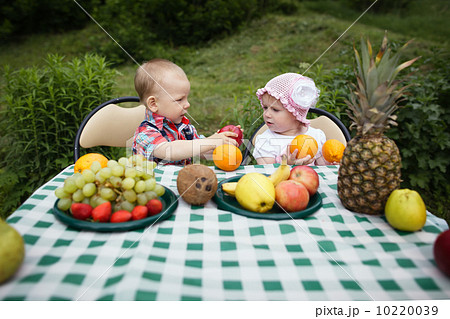 boy and girl on picnic in park boy and girl on picnic in park 10220039