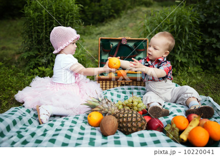 boy and girl on picnic in park boy and girl on picnic in park 10220041