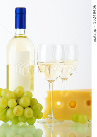Bottle of white wine, wine glasses, cheese and grape Bottle of white wine, wine glasses, cheese and grape 10249406