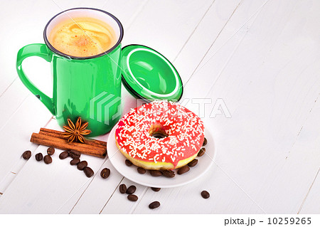 Tasty donut with a cup of coffee Tasty donut with a cup of coffee 10259265