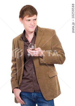 Handsome man posing with a glass of whiskey 10259588