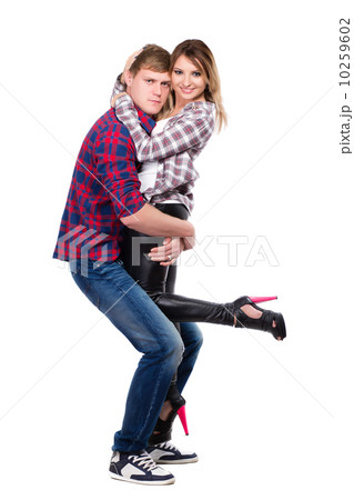 Cheerful pair posing in casual clothes Cheerful pair posing in casual clothes 10259602