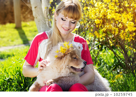 Girl with her dog on the nature 10259745
