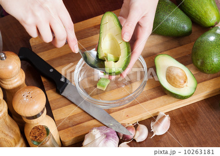 female hands cooking with avocado 10263181