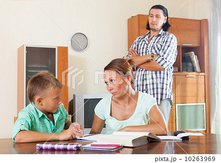 Ordinary family doing homework 10263969