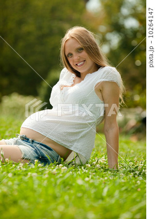 Woman relaxing on grass Woman relaxing on grass 10264147