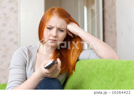 Red-haired teenager girl having disappointment Red-haired teenager girl having disappointment 10264422