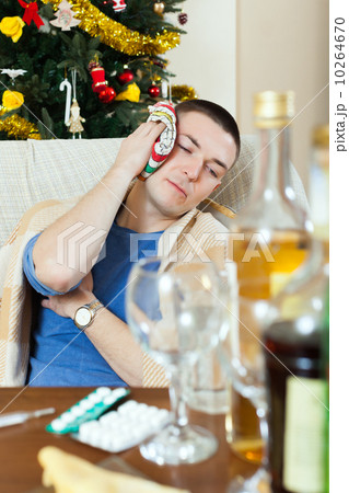 Sick having hangover after celebrating of New year party Sick having hangover after celebrating of New year party 10264670