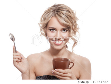 Young happy woman with an aromatic coffee in hands. Isolated 10264782