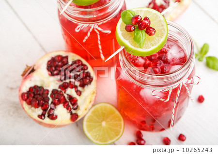 Two glasses with red pomgranate juice, lime and mint. 10265243