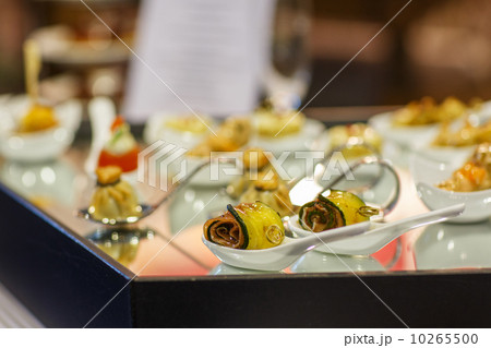 Different tasty snacks on luxury banquet table 10265500