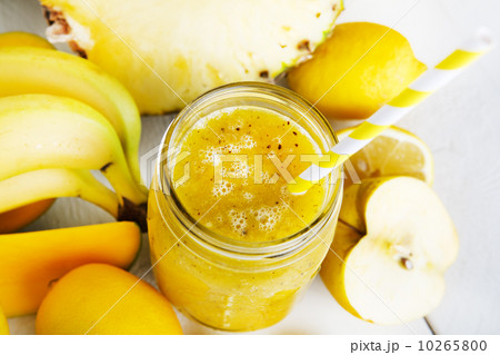 Fresh organic yellow smoothie with banana, apple, mango, pear, p Fresh organic yellow smoothie with banana, apple, mango, pear, p 10265800