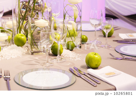 Elegant table set in green and white for wedding or event party. Elegant table set in green and white for wedding or event party. 10265801