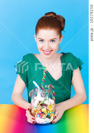 Girl with sweet goodies and candy 10279250
