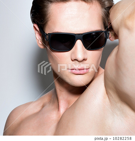 Portrait of young muscular sexy man in glasses. Portrait of young muscular sexy man in glasses. 10282258