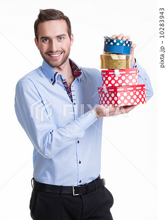 Portrait of happy young man with gifts. 10283943