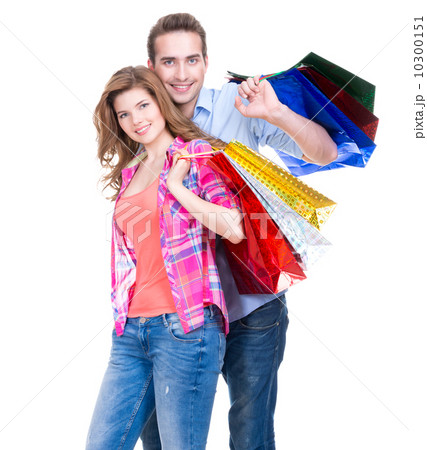 Happy couple with colored shopping bags. 10300151