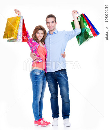 Happy couple with colored shopping bags. Happy couple with colored shopping bags. 10300156