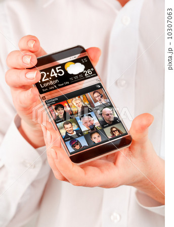 Smartphone with transparent screen in human hands. 10307063
