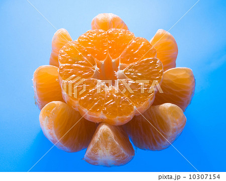 Ripe mandarin on blue background Ripe mandarin on blue background 10307154