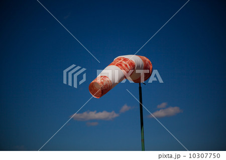 red wind vane against a blue sky 10307750