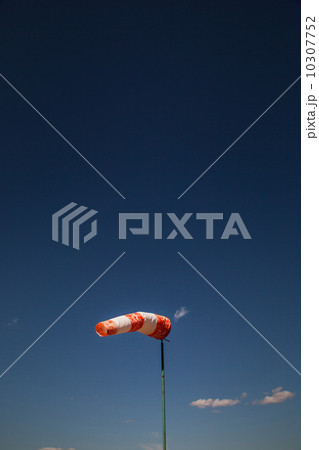 wind old sock against a blue sky 10307752