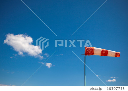 red wind vane against a blue sky 10307753