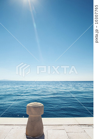 stone bollard on boat dock and sea stone bollard on boat dock and sea 10307765