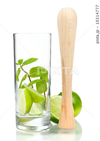 Mojito mix: lime, mint in glass and muddler 10314777