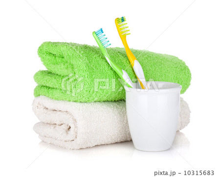 Toothbrushes and two towels Toothbrushes and two towels 10315683