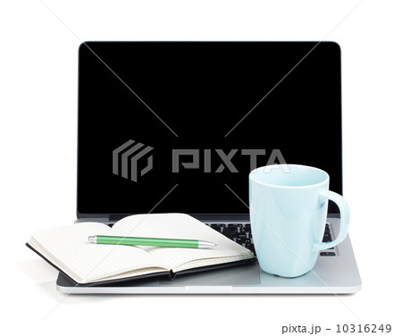 Tea cup and office supplies on laptop Tea cup and office supplies on laptop 10316249