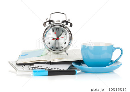 Blue coffee cup, alarm clock and office supplies 10316312