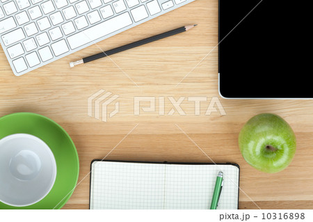 Office supplies, devices, coffee cup and apple 10316898