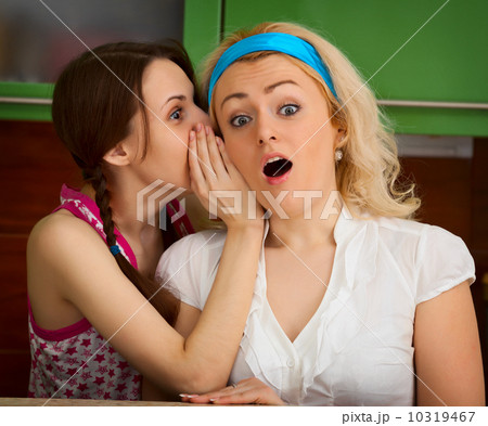 Girls gossiping in the kitchen Girls gossiping in the kitchen 10319467