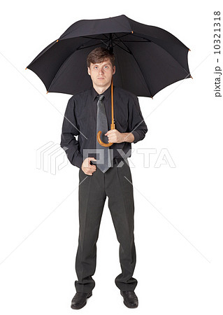Serious man in black clothes with an umbrella 10321318