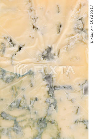 Slice of dor blue cheese. 10326517