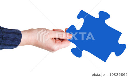 female hand with blue puzzle piece 10326862