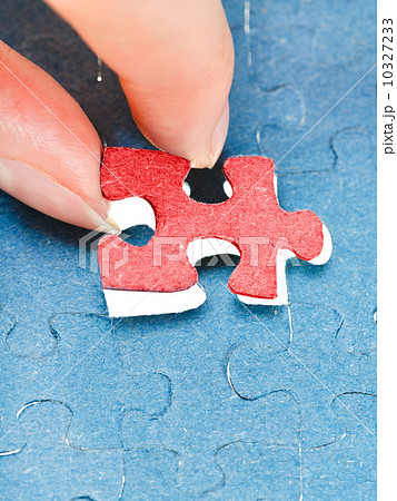 assembling the last red piece of puzzle 10327233