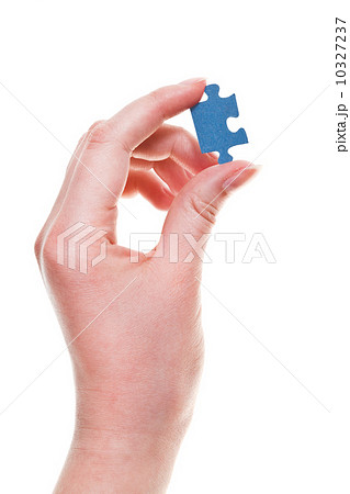 female arm with jigsaw puzzle piece 10327237