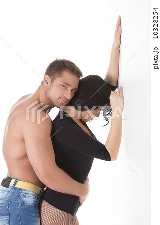 Hugging lovers posing in studio Hugging lovers posing in studio 10328254