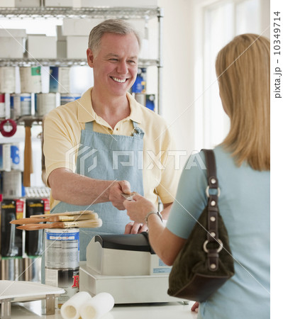 A woman buying paint A woman buying paint 10349714