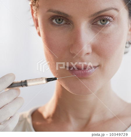 Woman with syringe Woman with syringe 10349729