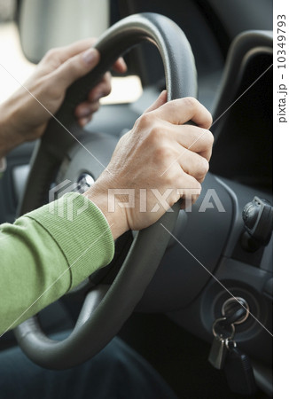Hands on a steering wheel 10349793